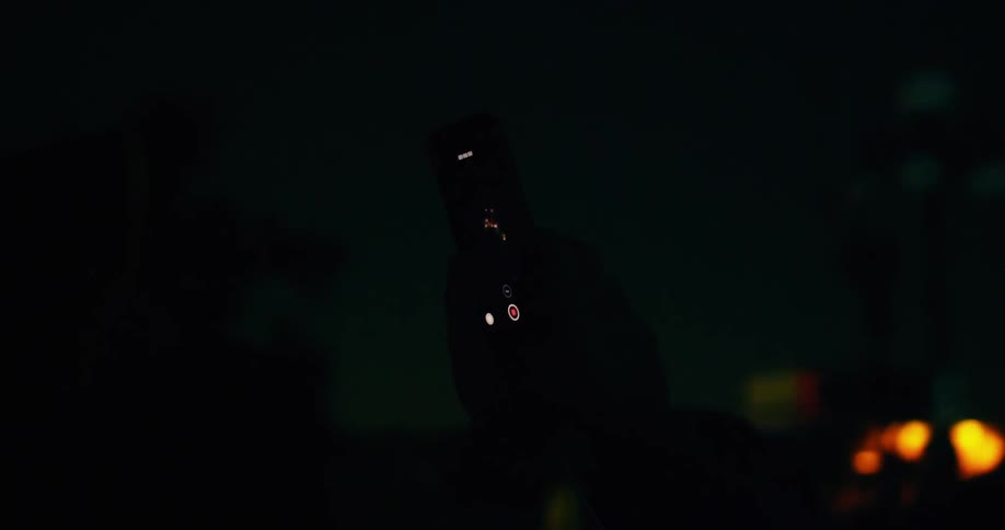 Person filming fireworks on a phone