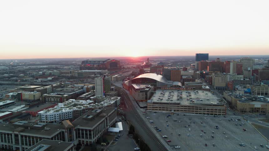 The sun rises over a city