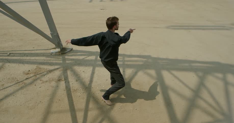 A man is dancing outside