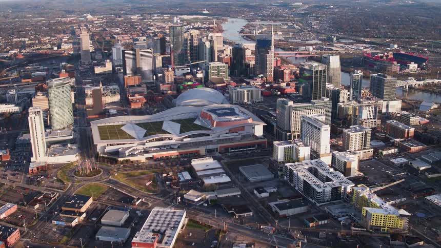 City buildings surround an athletic stadium