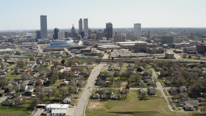 The houses are near the edge of the city
