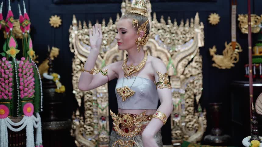 Woman moves her arms gracefully