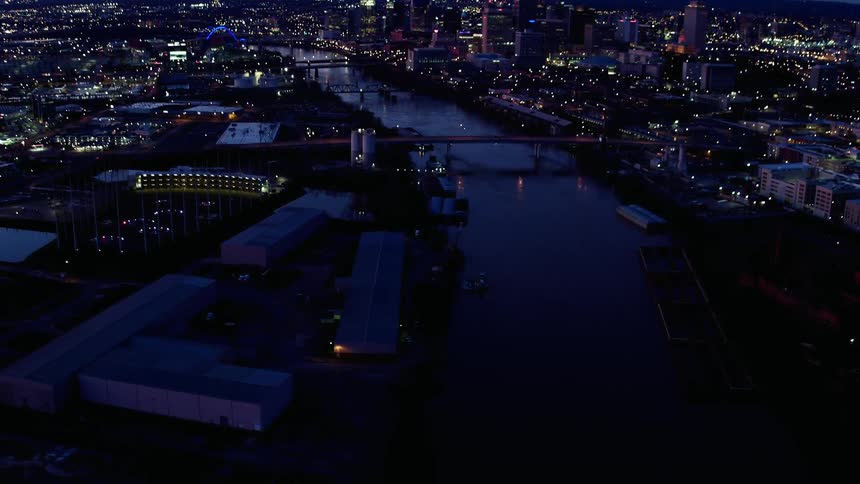 The water in the river is calm near the city