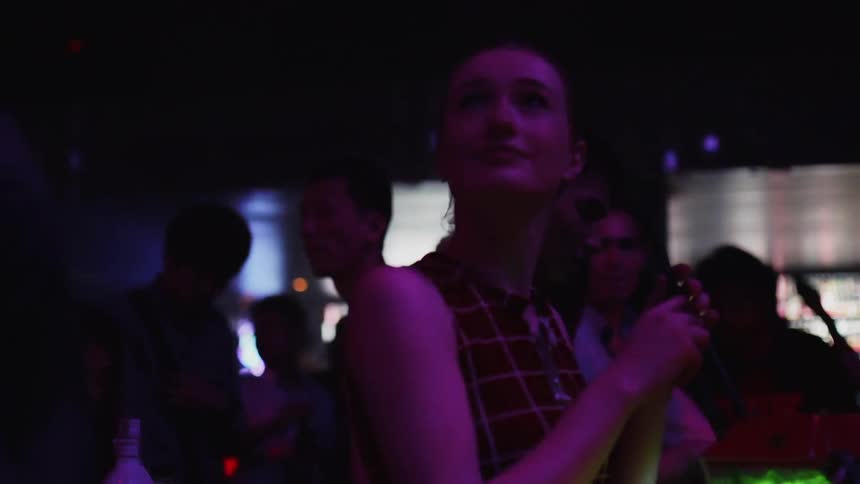 People are partying under the blinking lights