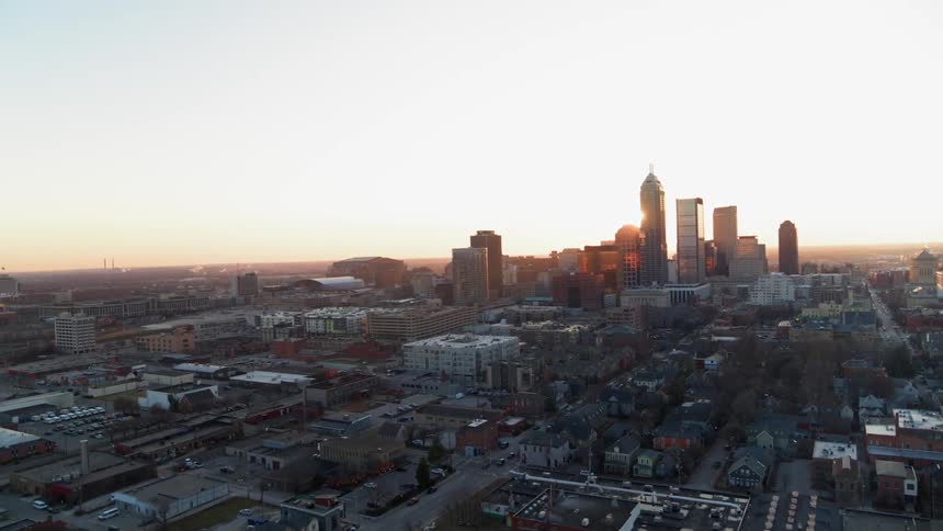 The sun is setting on the large city