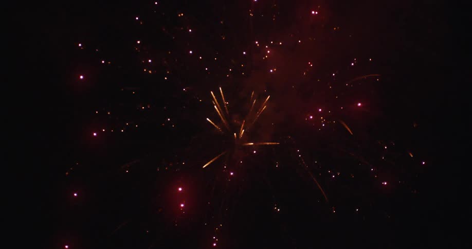 Fireworks are exploding in the sky at night