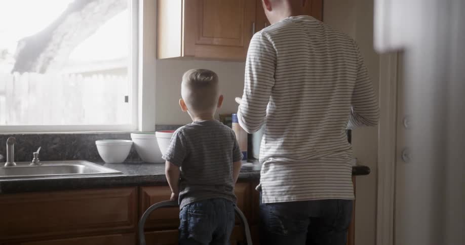A family work together in the kitchen
