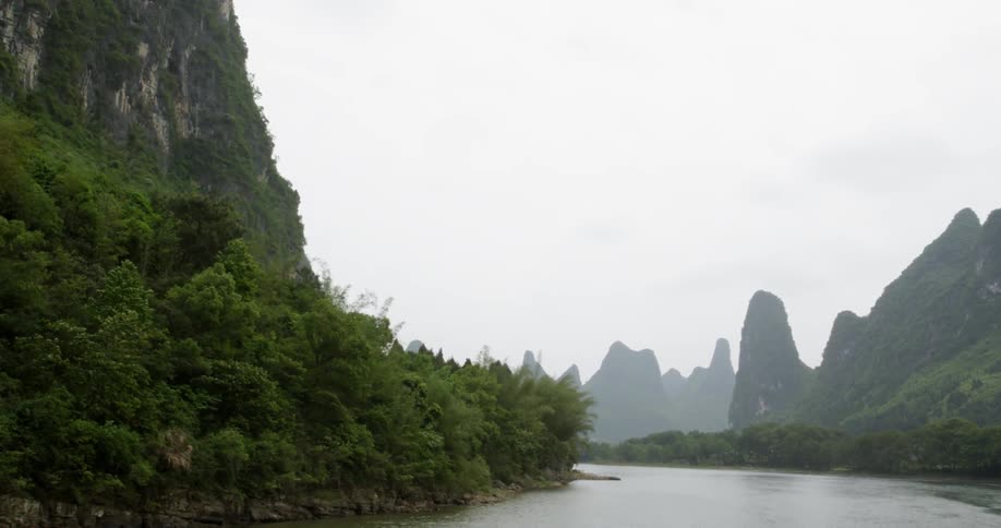 River flows through trees and mountains