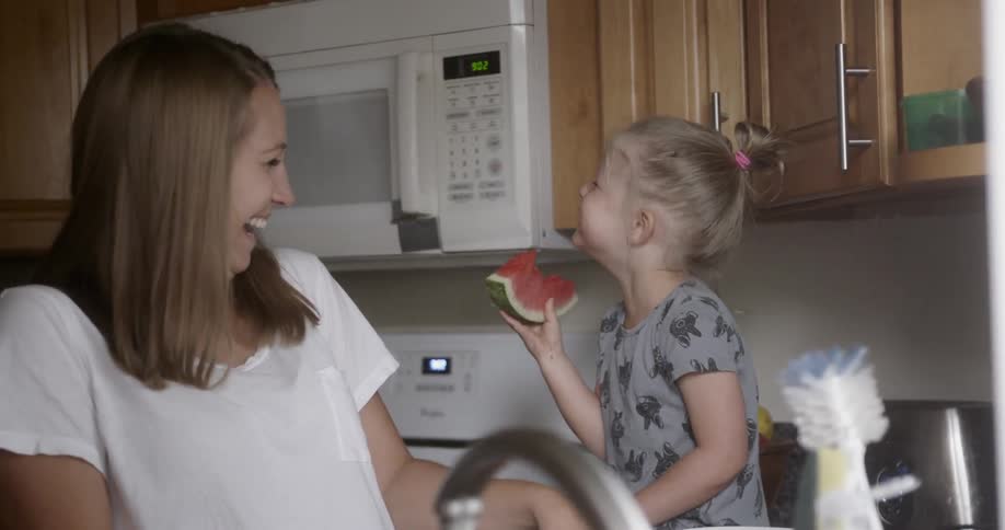 Mother and daughter laughing together