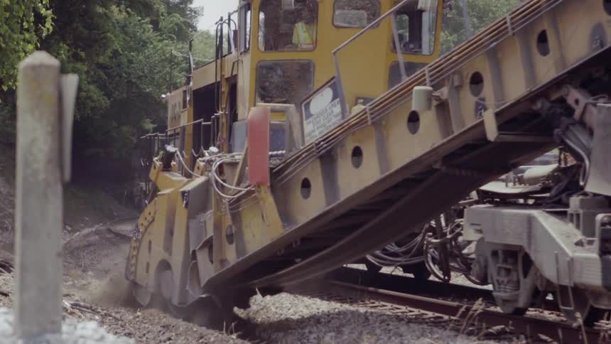 The construction machine digs a trench
