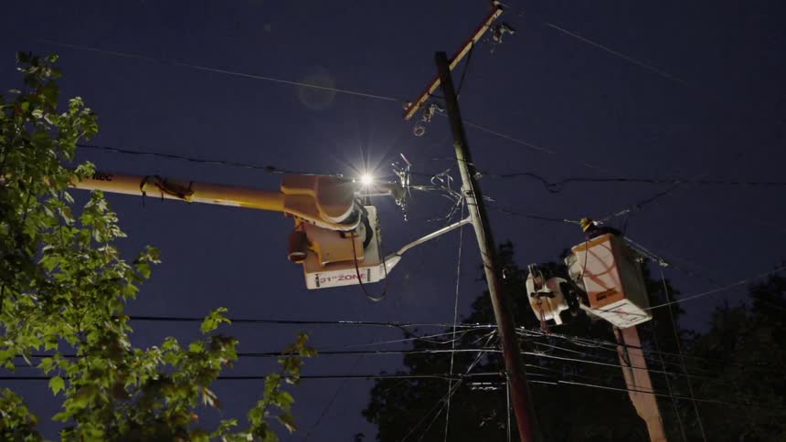 The people are working on the power lines