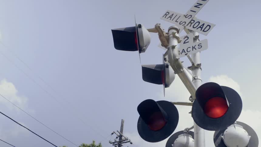Lights flash at a railroad crossing