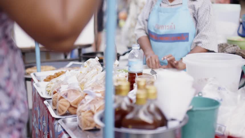 Street vendors serve customers