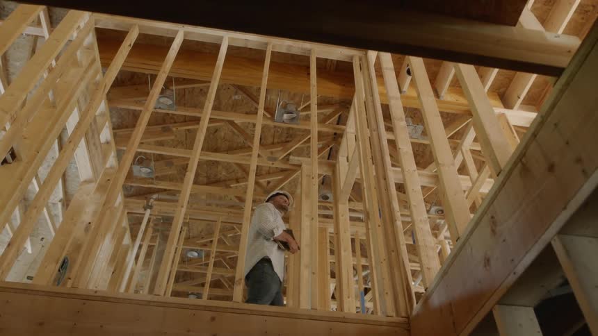 A man walks on a construction site