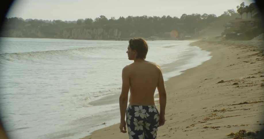 A man stands on the beach
