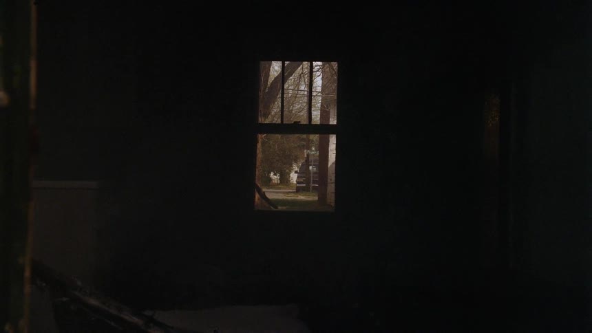 A sheet blows by the window