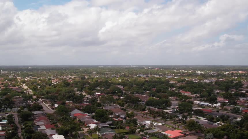 White clouds pass above the town