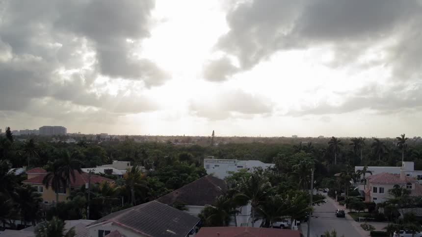 Clouds float above a beach town