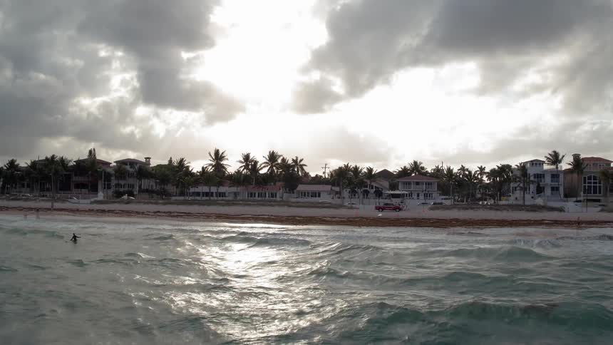 Ocean waves flow towards a shoreline