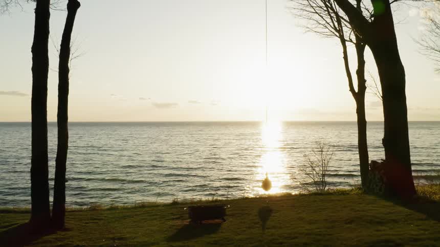 Sunlight reflects on an ocean at sunset