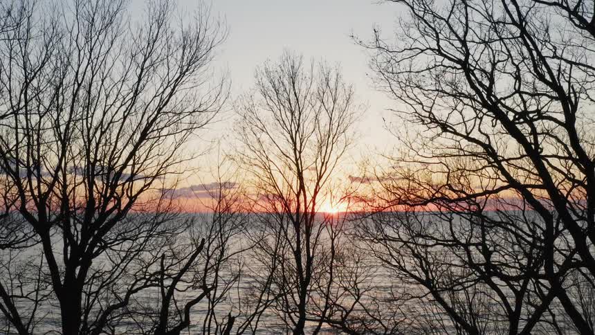 The sun sets over an ocean