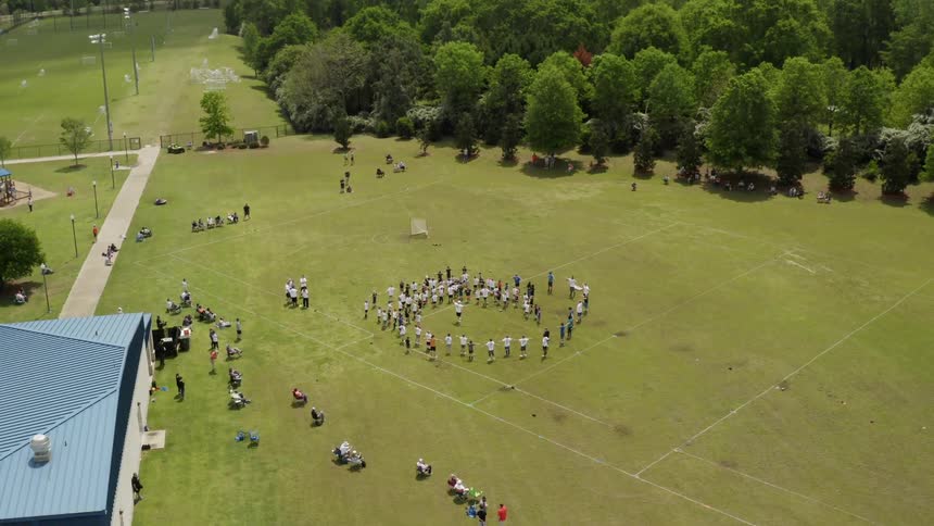 People gather in a grassy field