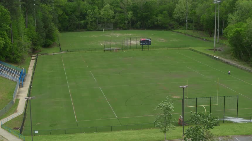 The green field is empty ahead