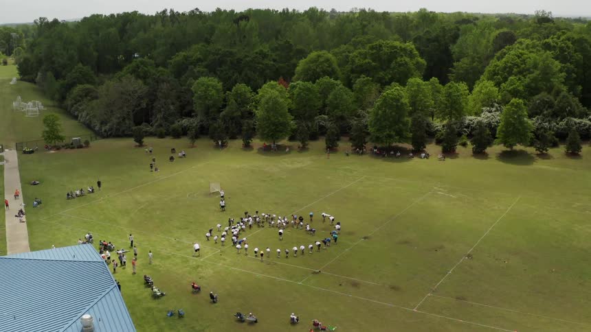 A group of people gather in a circle