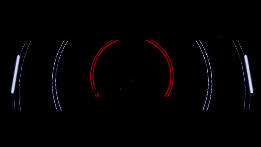 Man dances in front of a screen as it illuminates