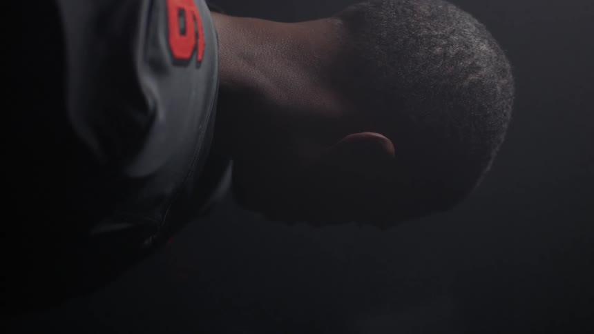 The football player stands up