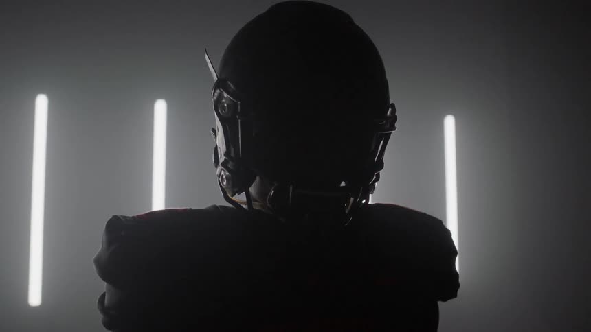 Lights briefly flash on the football player