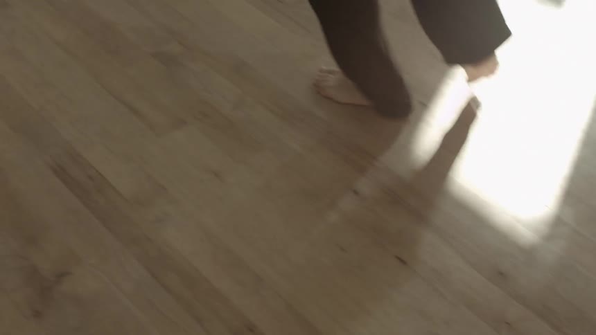 A man dances in a studio