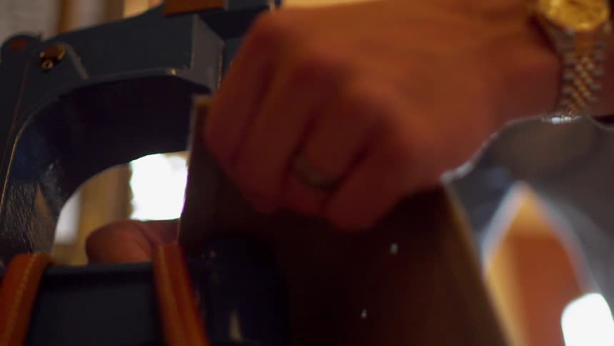 A man is opening a machine in the shop