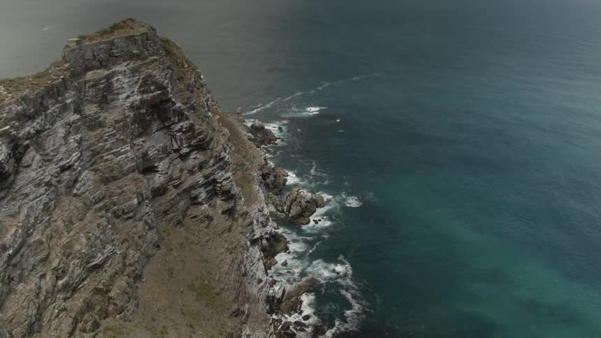 A woman overlooks the ocean