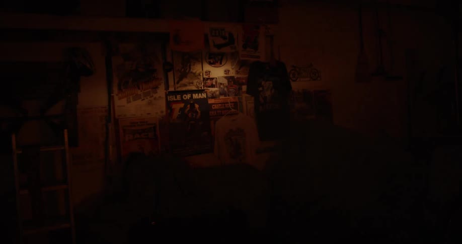 The sun shine illuminates posters on the wall