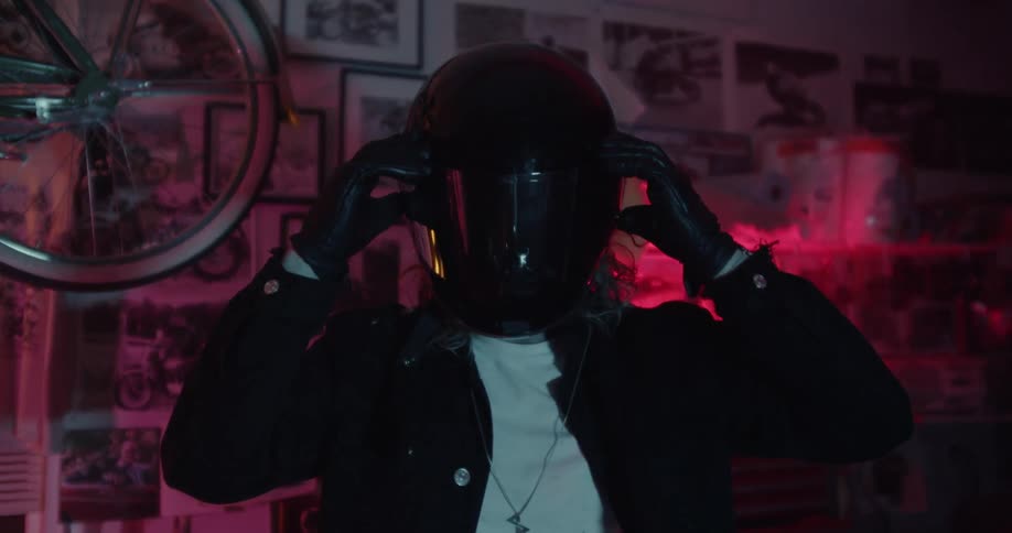 Man pulls the visor down from his helmet