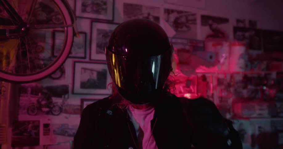A man lowers the visor on his helmet