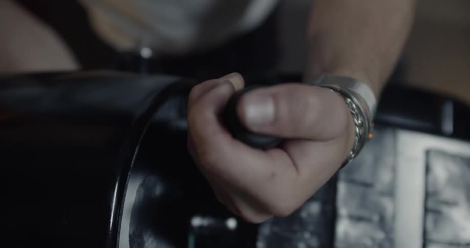 A man turns a lever