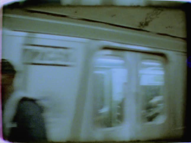 A train drives through an underground subway