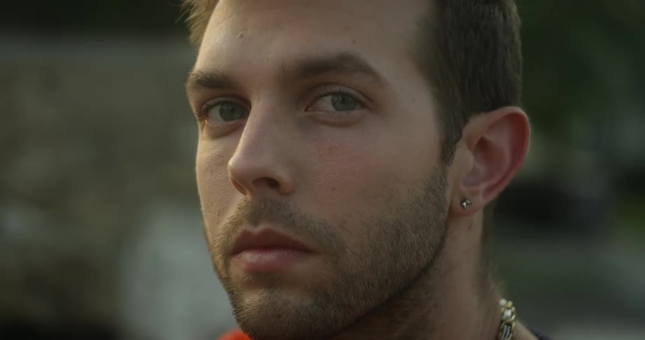 A serious man looks to the side