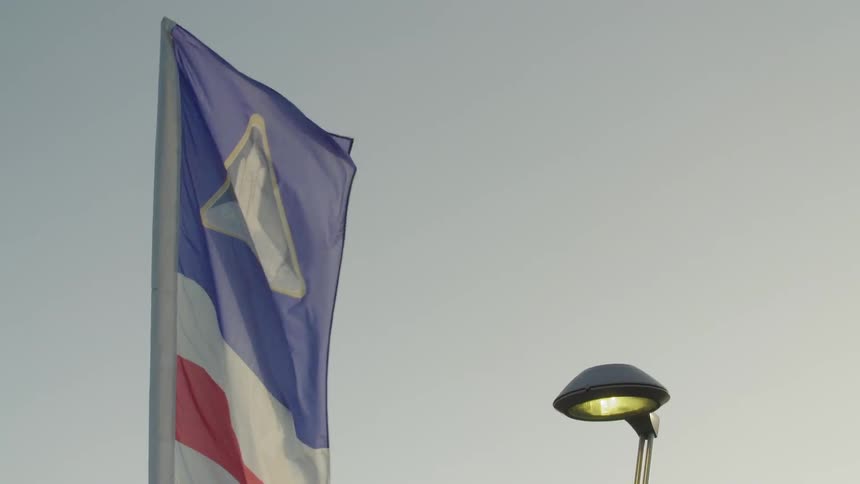 Colorful flag blows in the breeze