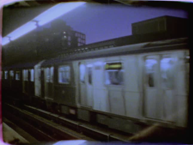 Train passing by a platform in the city