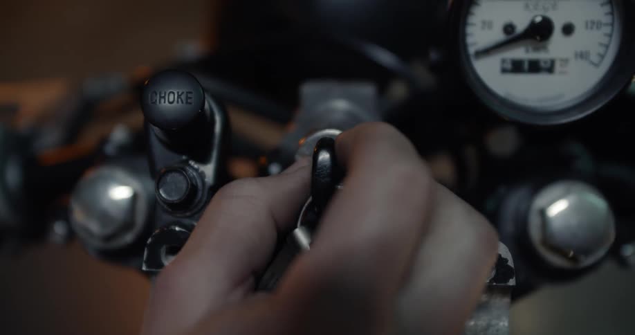 A man turns a key