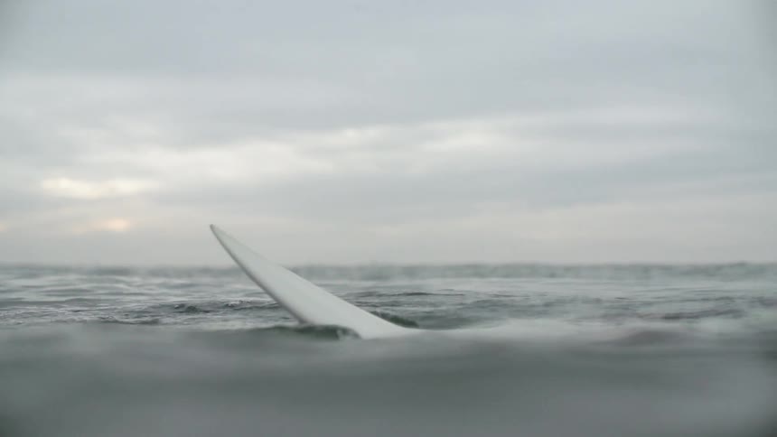 Woman Surfing In The Ocean