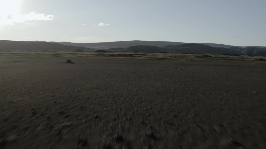Large field sits under the sunny sky
