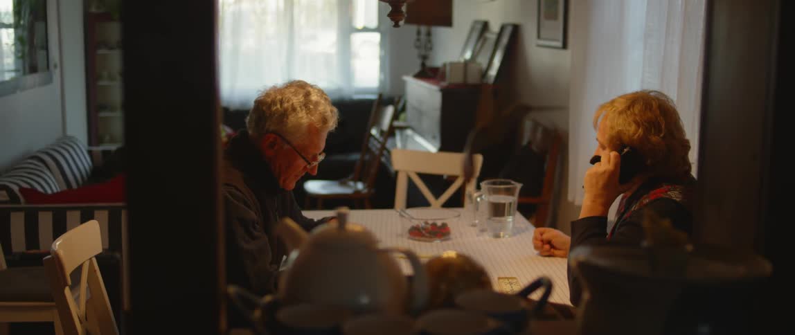 Two people sit at a table together