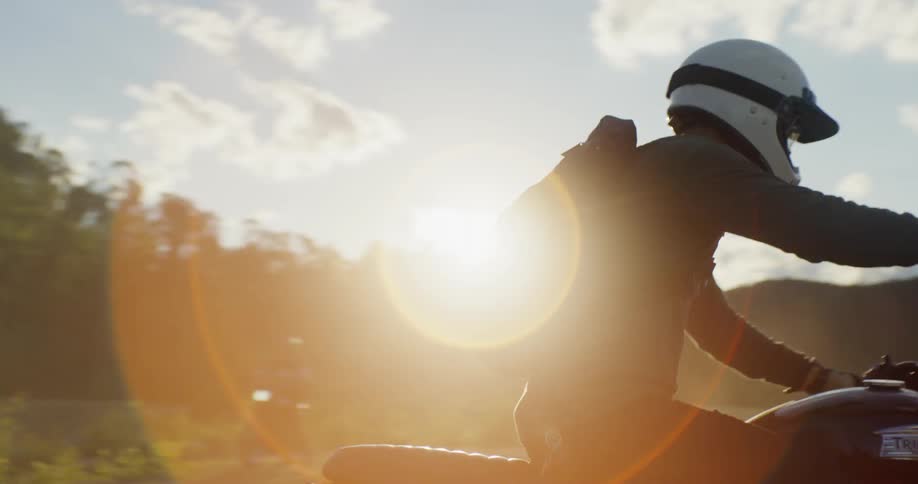 A man rides a bike on the dirt