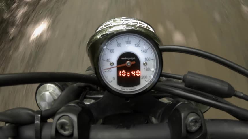 Motorbike driving down a road