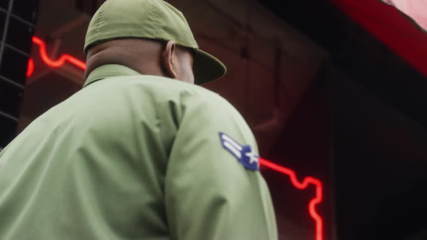 A soldier walks towards a diner