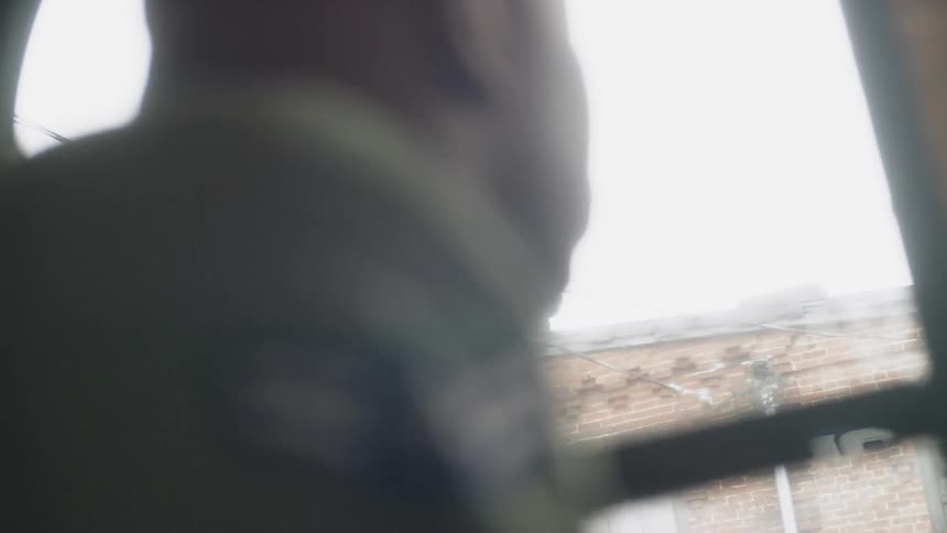 A soldier rides on the bus